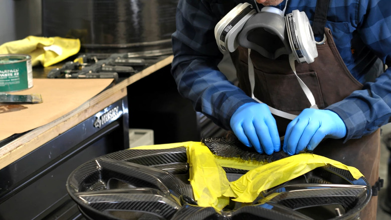A mechanic showing how fix a carbon fiber wheel