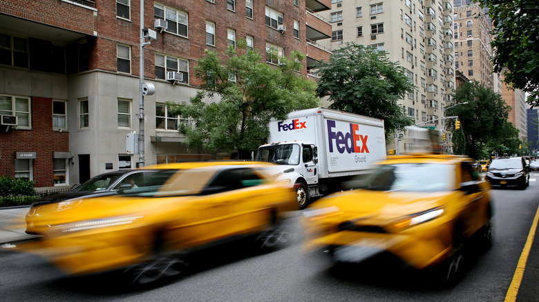 Two taxi cabs drive past the gaze of a speed camera on the streets of New York.