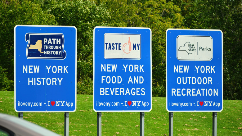 Signs near the Seneca Travel Plaza rest stop along the NY State Thruway.