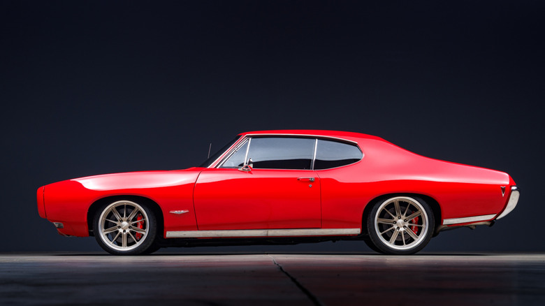 The side profile of a modified Pontiac GTO muscle car