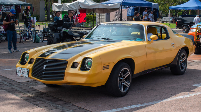 A modified yellow 1970 Chevrolet Camaro muscle car