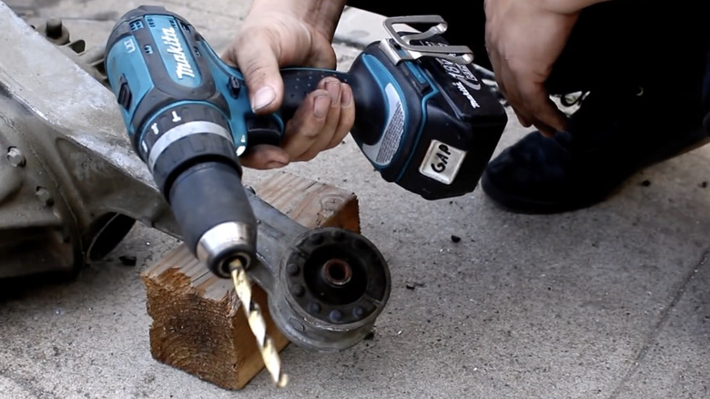A drill that was used to cut out an old bushing in a NA-generation Miata differential.