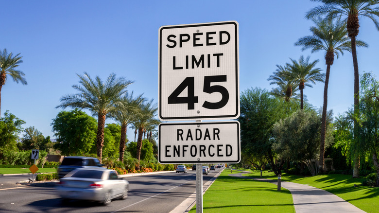 A 45-mph speed limit sign along a busy road.
