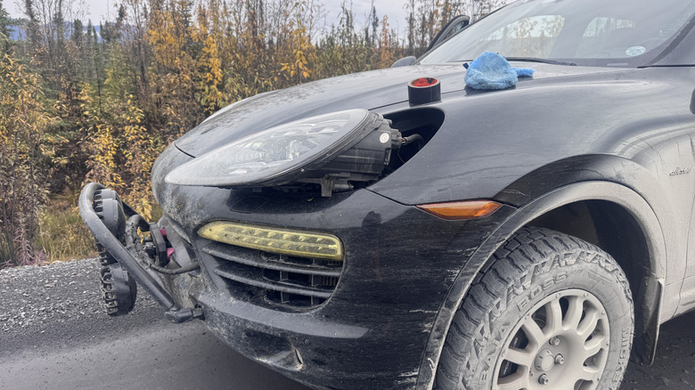 Porsche Cayenne with broken headlight brackets