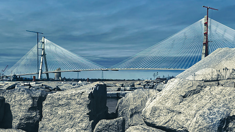 The Gordie Howe International Bridge with rocks in the foreground