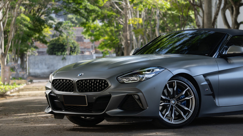 Minas Gerais, Brazil - 26 11 2025: Grey BMW Z4 convertible front end view top closed, Matte paint luxury roadster on asphalt