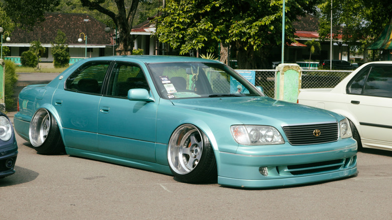 A stanced Lexus car in a parking lot