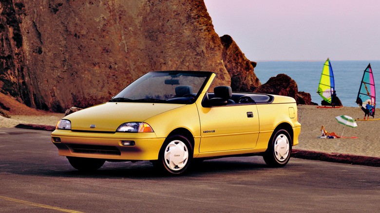Front 3/4 view of a yellow Geo Metro convertible