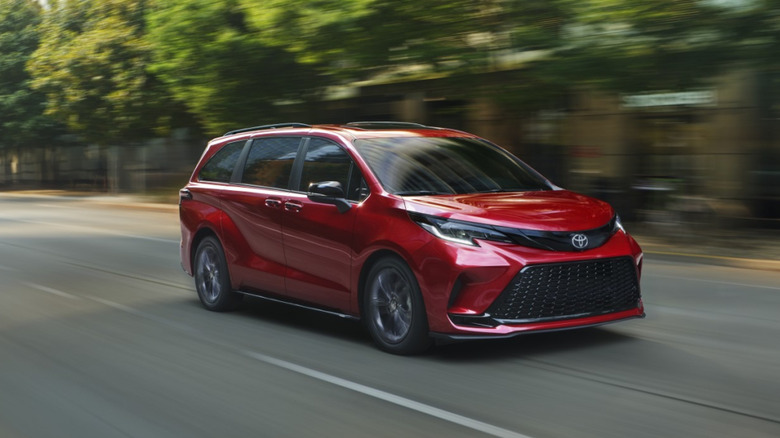 Front 3/4 view of a red Toyota Sienna