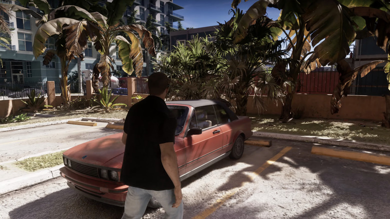 Jason walking up to his red E30-like convertible in GTA6.