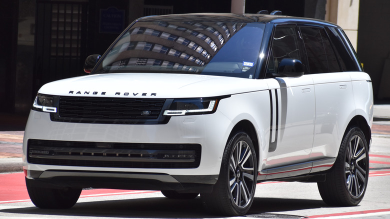 A white Range Rover sits parked.
