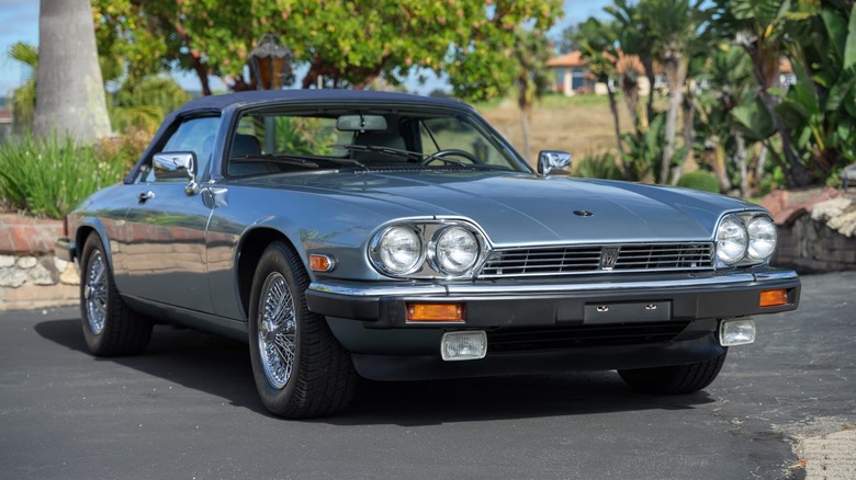 Front 3/4 view of a silver Jaguar XJS convertible