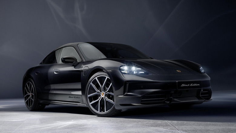 A Taycan 4S Black Edition parked with its lights on