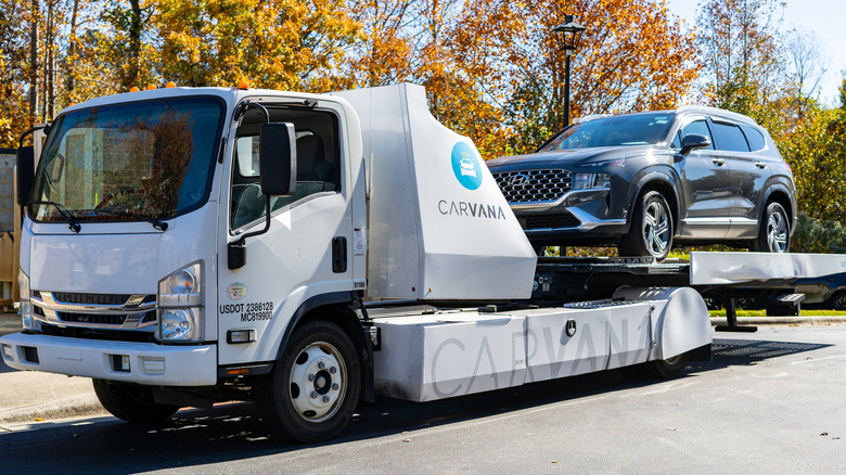 A Carvana vehicle being delivered