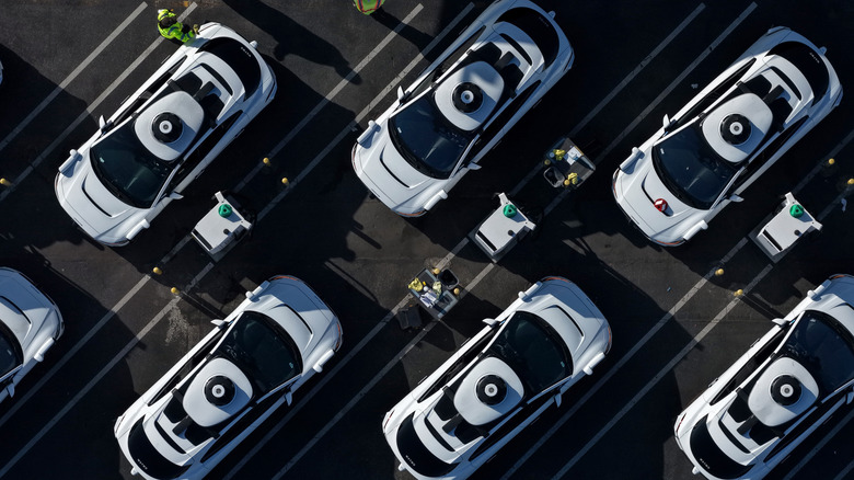 In an aerial view, Waymo robotaxis sit parked at a Waymo facility on December 08, 2025 in San Francisco, California.