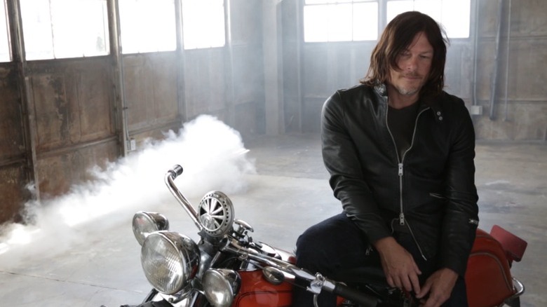 Norman Reedus on a bike during an interview