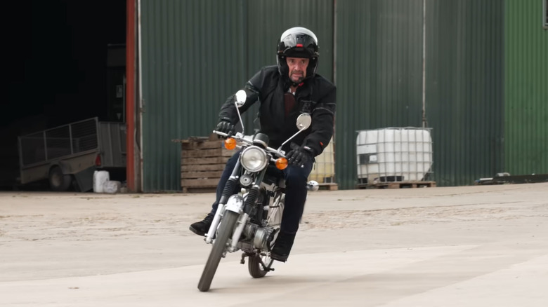 Richard Hammond riding a bike in an industrial area