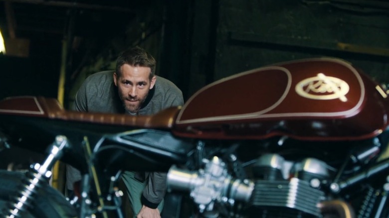 Ryan Reynolds taking a look at his new custom bike