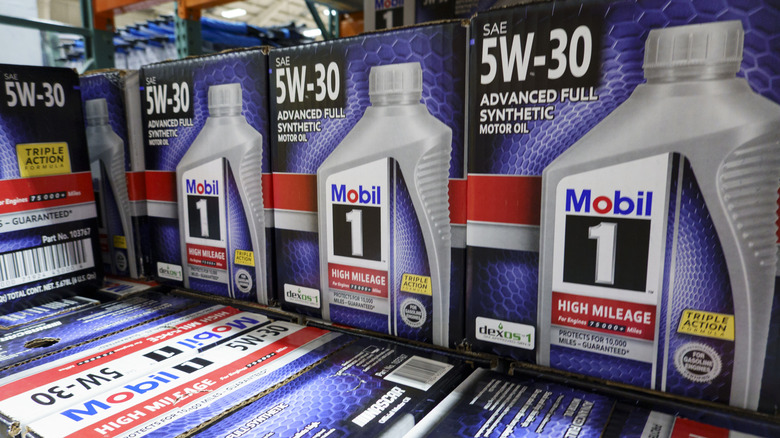 Boxes of bottles of synthetic Mobile 1 at an auto parts store.