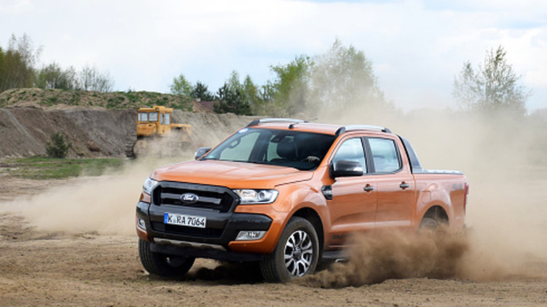 A Ford Ranger on a dusty road in Europe.