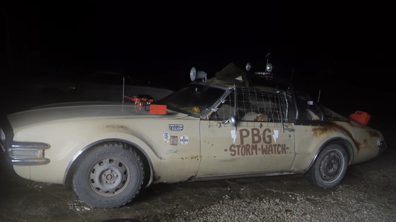 Side view of the official Pole Barn Garage storm watch 1968 Oldsmobile Toronado tornado chase vehicle