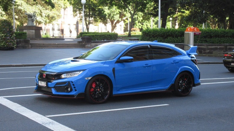 A blue 2020 Honda Civic Type R in a paking lot