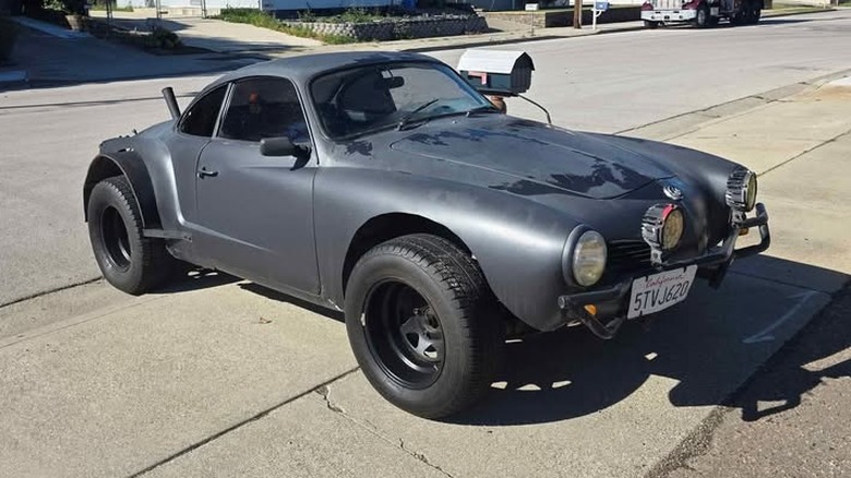 A lifted black Volkswagen Karmann Ghia