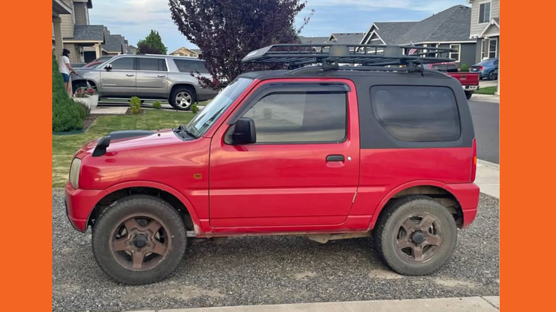 A red Suzuki Jimny
