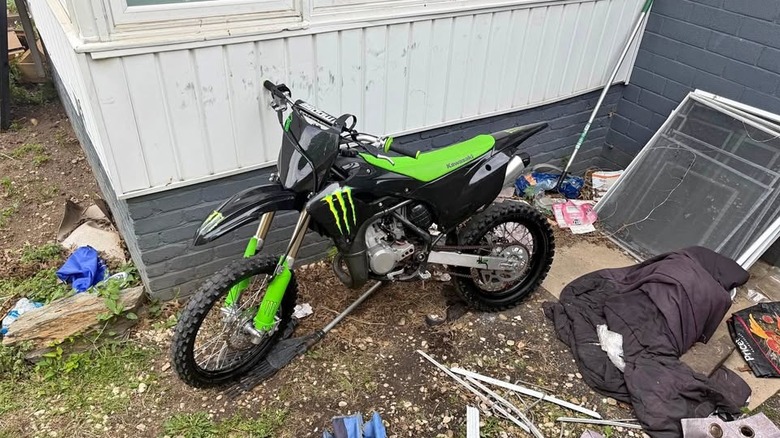 A black and green Kawasaki KX112