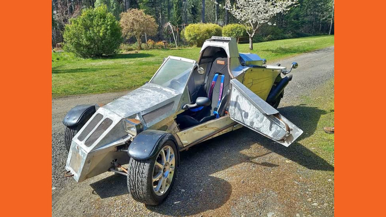A silver homemade trike