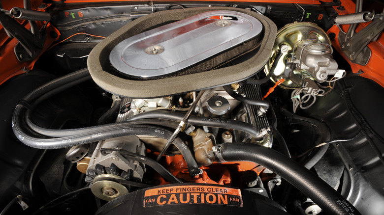 The 1969 Chevrolet Camaro Z/28 302 cubic inch small block V8 with the dual four barrel Holley crossram aluminum intake