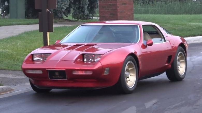 A red Chevrolet Corvette XP-897 GT Two-Rotor concept car on a road
