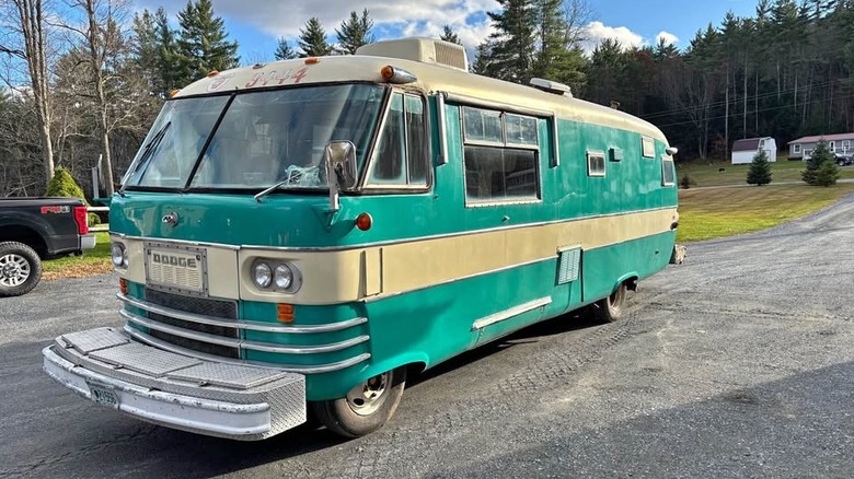 A teal and off white motor home