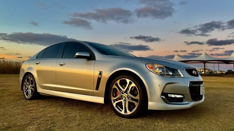 A silver Chevy SS sedan at sunset