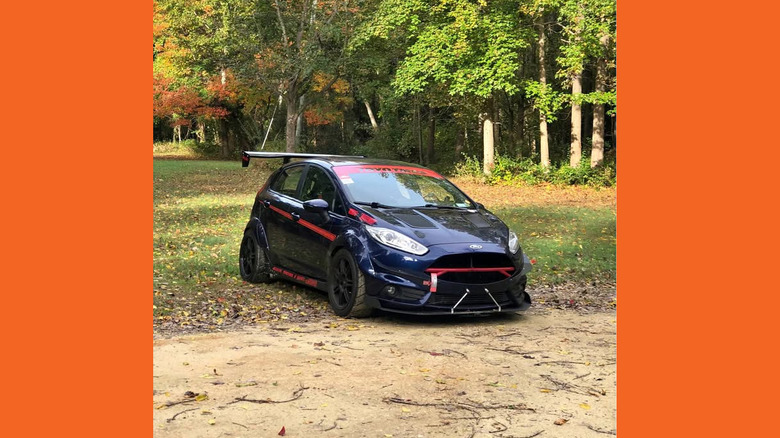 A dark blue Ford Fiesta ST with a lot of mods