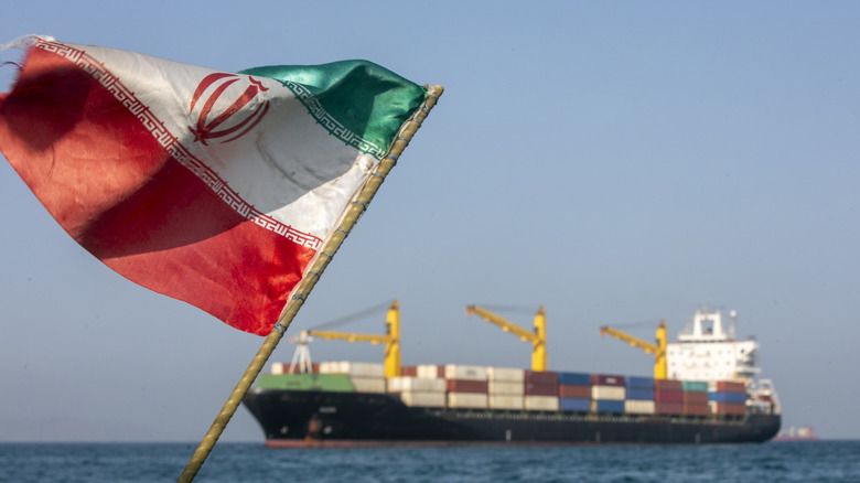STRAIT OF HORMUZ, IRAN - MAY 16: An Iranian flag flutters in the wind as ships remain anchored on May 16, 2026 in the Strait of Hormuz near Larak Island, Iran. Negotiations between the U.S. and Iran over opening this critical waterway have largely stalled as the countries have rejected each other's proposals to end the war that began when the U.S. and Israel attacked Iran on February 28. (Photo by Majid Saeedi/Getty Images)