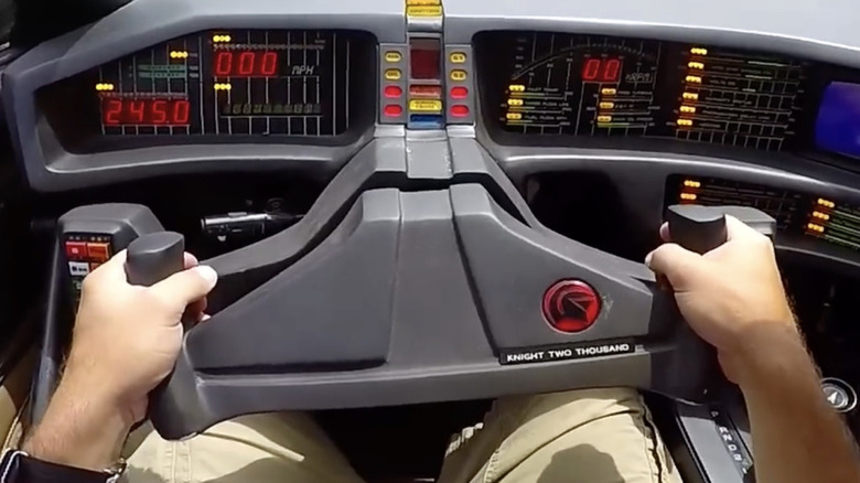 The yoke steering wheel and dashboard inside a replica of KITT from "Knight Rider"