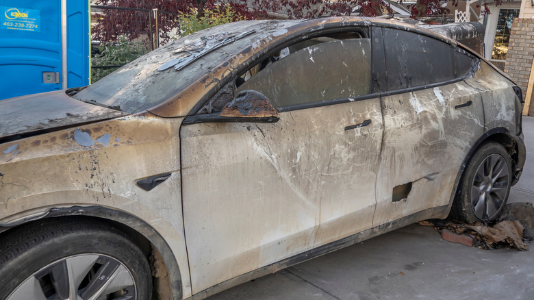 A burnt Tesla that was damaged in a fire