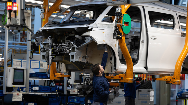 HANOVER, GERMANY - MARCH 4: A worker assembles a VW ID. Buzz electric van at the Volkswagen commercial vehicles van and bus factory on March 4, 2026 in Hanover, Germany. Volkswagen, Germany's biggest car maker, is scheduled to announce financial results on March 10. (Photo by Christian Ender/Getty Images)