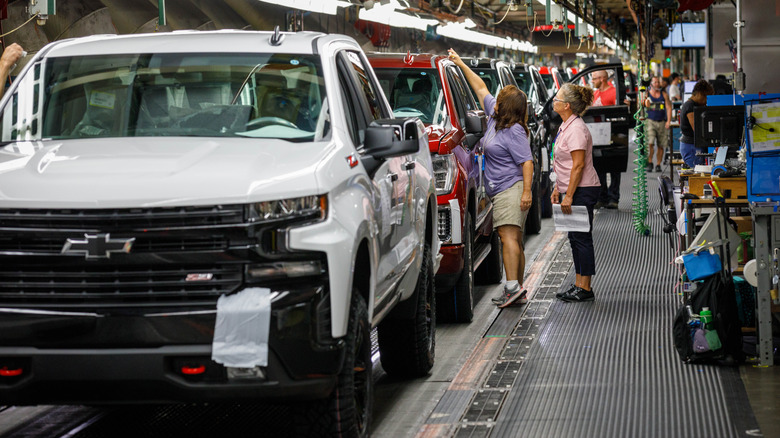 Trucks come off the assembly line at GM's Chevrolet Silverado and GMC Sierra pickup truck plant in Fort Wayne, Indiana, U.S.