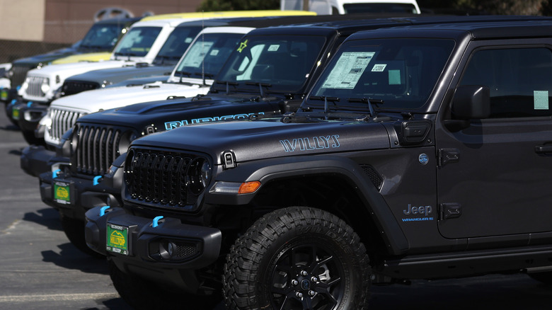 Jeep Wrangler 4Xe plug-in hybrids are displayed on the sales lot at Hilltop Chrysler Jeep Dodge Ram on April 05, 2024 in Richmond, California.