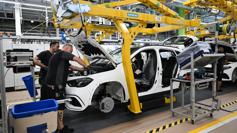 Workers assemble Various models from Mercedes-Benz at the Mercedes-Benz assembly plant on June 4, 2025 in Rastatt, Germany.