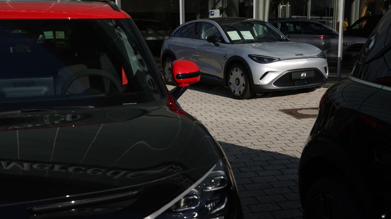 Smart electric cars stand on display at a Mercedes-Benz dealership on October 23, 2024 in Berlin, Germany.