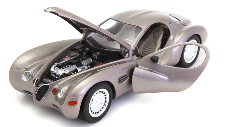 A Chrysler Atlantic concept with its driver's door and hood open, showing off its straight-8 engine.