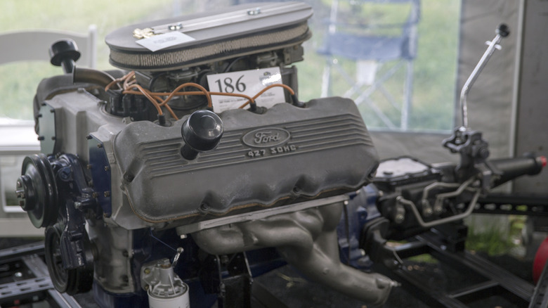 A high-performance Ford 427 "Cammer" V8 coupled to a Ford "Top-Loader" four-speed manual transmission.