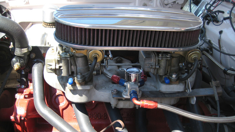 A Chrysler Slant-Six engine with two carburetors and an aftermarket air cleaner