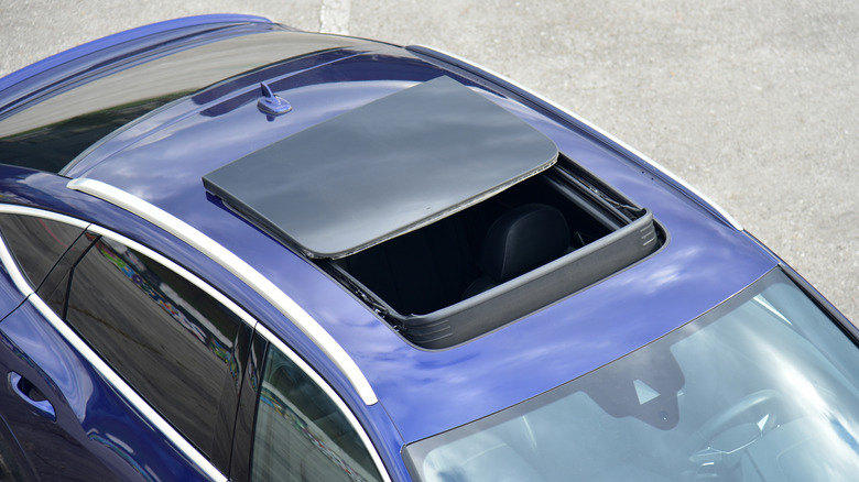 Car with an open sunroof
