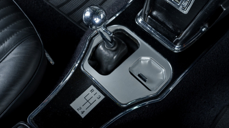 A closeup of a C1 Corvette four-speed manual transmission shifter