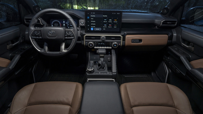 The interior of a 2026 Toyota 4Runner with perforated brown leather seats and leather accents.
