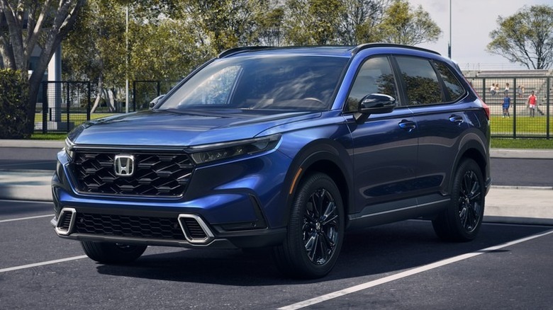 A blue 2026 Honda CR-V hybrid in a parking lot